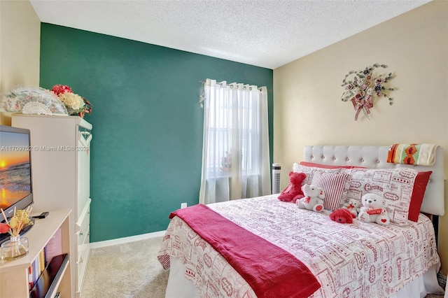 bedroom with carpet floors and a textured ceiling