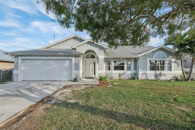 ranch-style home with a garage and a front yard