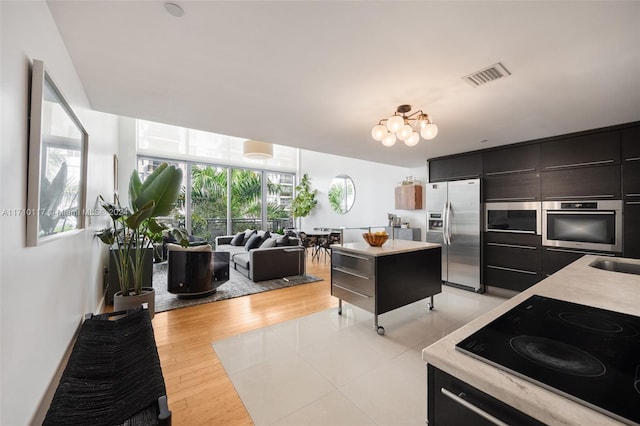 kitchen featuring light hardwood / wood-style floors, sink, and stainless steel appliances