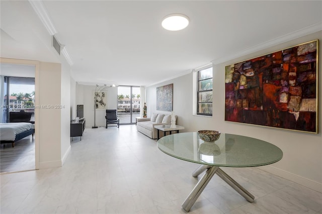 interior space with ornamental molding and a healthy amount of sunlight