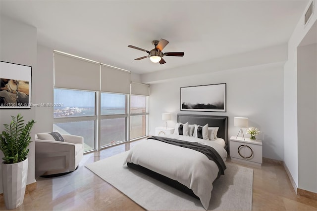 bedroom featuring ceiling fan and access to outside