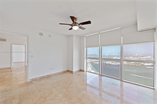 empty room featuring ceiling fan