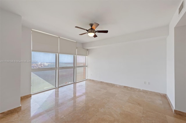 unfurnished room featuring ceiling fan