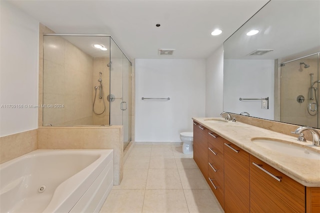 full bathroom with tile patterned flooring, vanity, shower with separate bathtub, and toilet