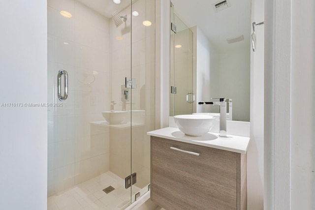 bathroom with an enclosed shower and vanity