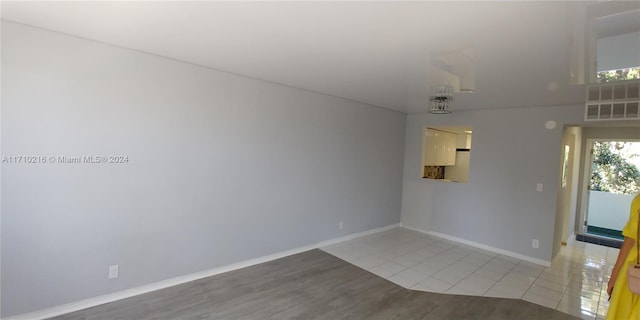 unfurnished room with light tile patterned floors