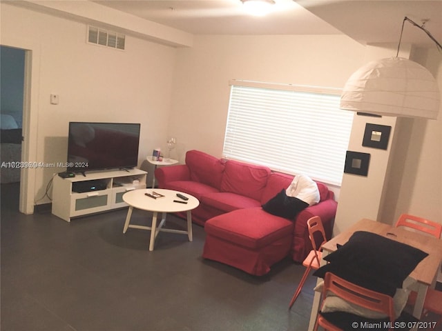 living room featuring vaulted ceiling