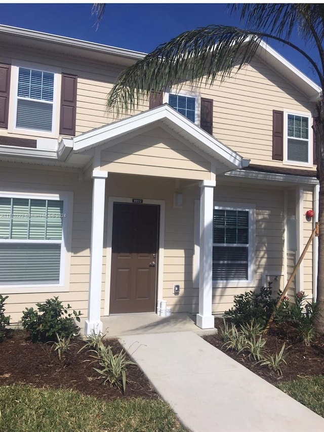 doorway to property featuring a porch