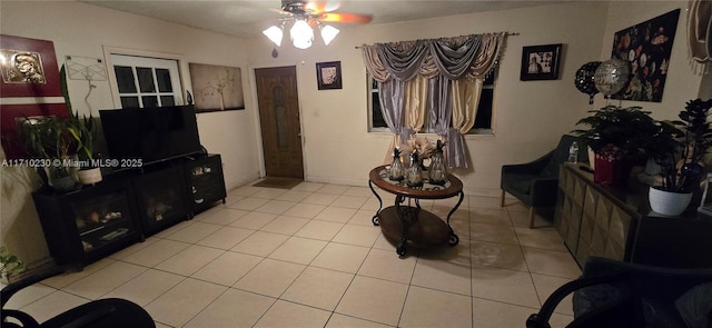 tiled living room featuring ceiling fan