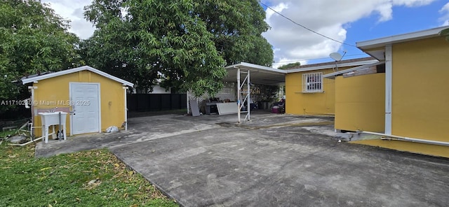 view of patio featuring a storage shed