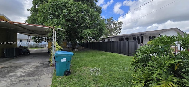 view of yard with central air condition unit