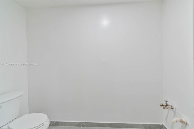 bathroom featuring tile patterned floors and toilet