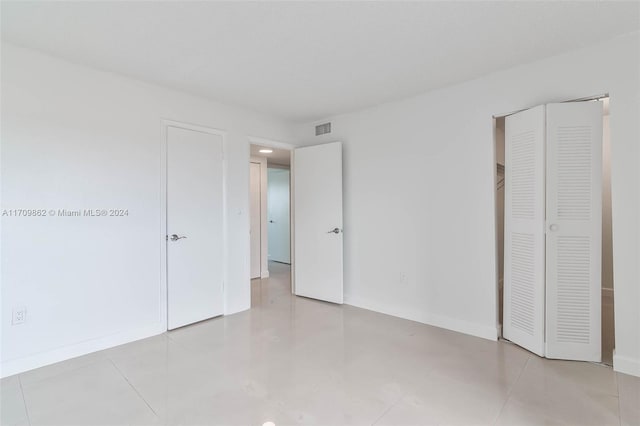 unfurnished bedroom featuring light tile patterned floors