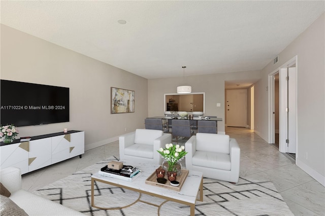 living room with a textured ceiling