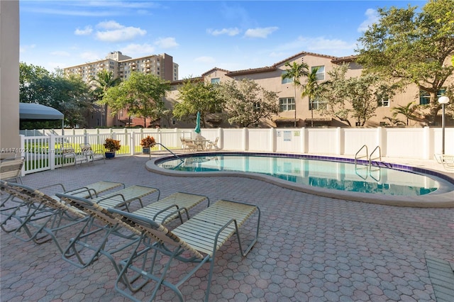 view of swimming pool with a patio