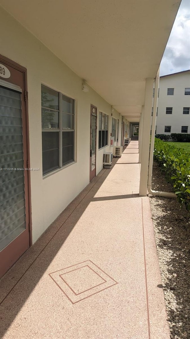 view of patio with a wall mounted air conditioner