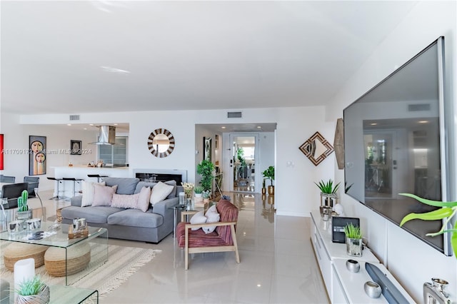 tiled living room with a fireplace