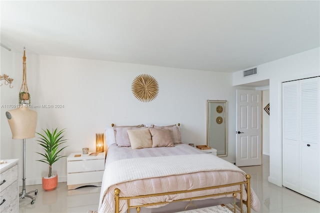 1800 NE 114th St Unit 1105, Miami, FL 33181 - bedroom featuring a closet and light tile patterned flooring