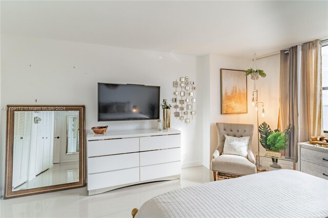 bedroom with light tile patterned floors