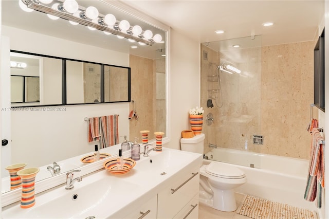 full bathroom featuring vanity, tiled shower / bath combo, tile patterned floors, and toilet