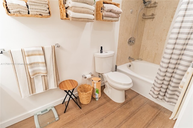 bathroom featuring shower / bath combo and toilet