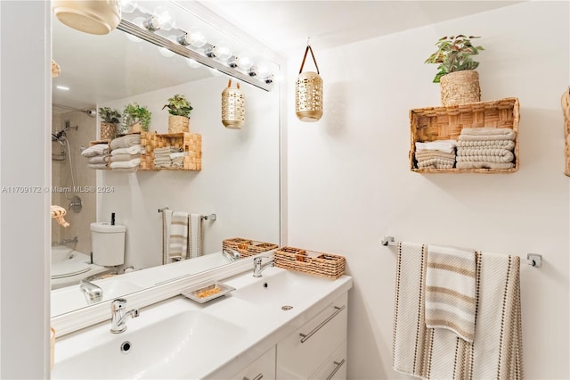 full bathroom featuring toilet, vanity, and tiled shower / bath