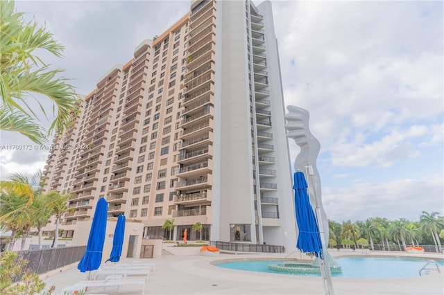 view of property with pool water feature