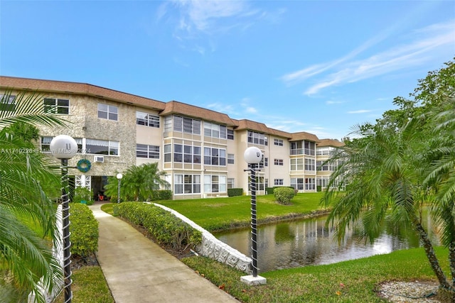 view of building exterior with a water view