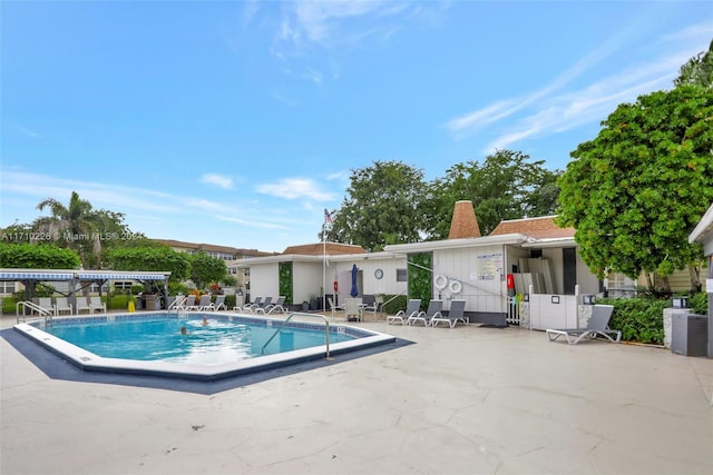 view of swimming pool featuring a patio and central AC unit