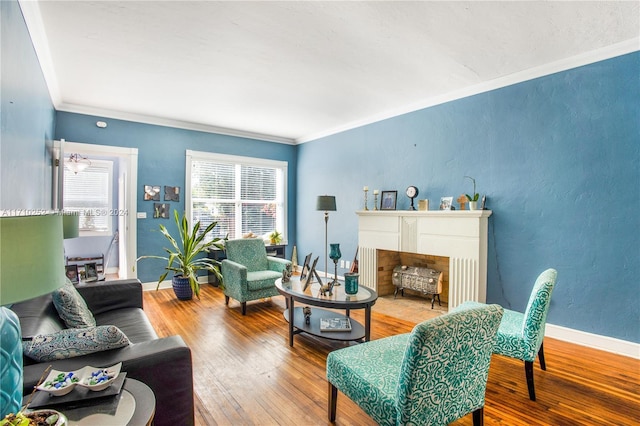 living room with a chandelier, crown molding, and wood-type flooring