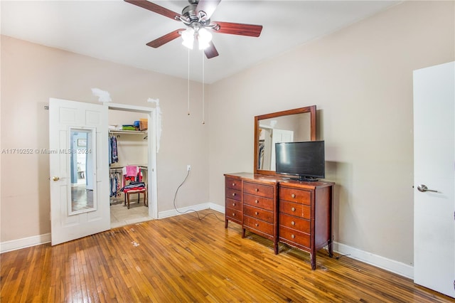 interior space with a closet, hardwood / wood-style floors, and ceiling fan