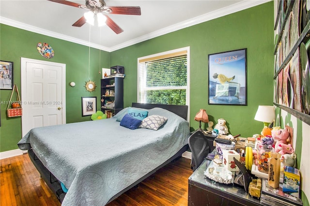 bedroom featuring ceiling fan, dark hardwood / wood-style flooring, and ornamental molding