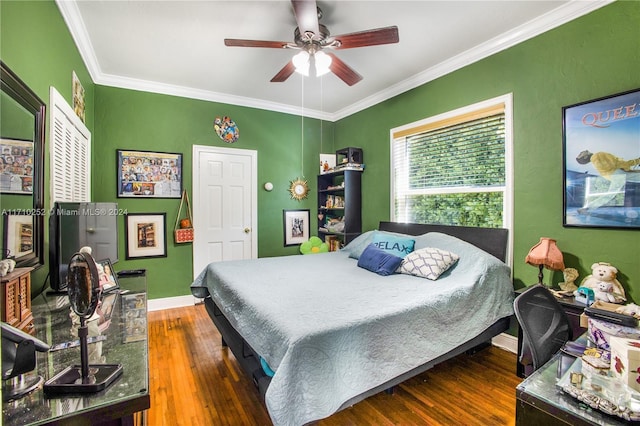 bedroom with ceiling fan, dark hardwood / wood-style flooring, and crown molding