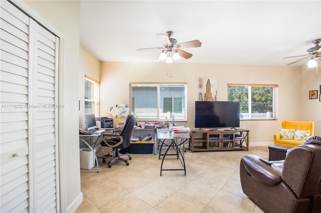 home office with ceiling fan and light tile patterned floors