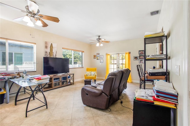 living room with ceiling fan, light tile patterned floors, and french doors