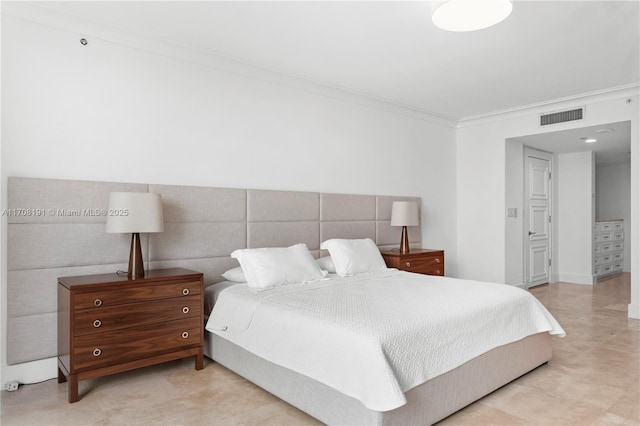 bedroom featuring visible vents and crown molding