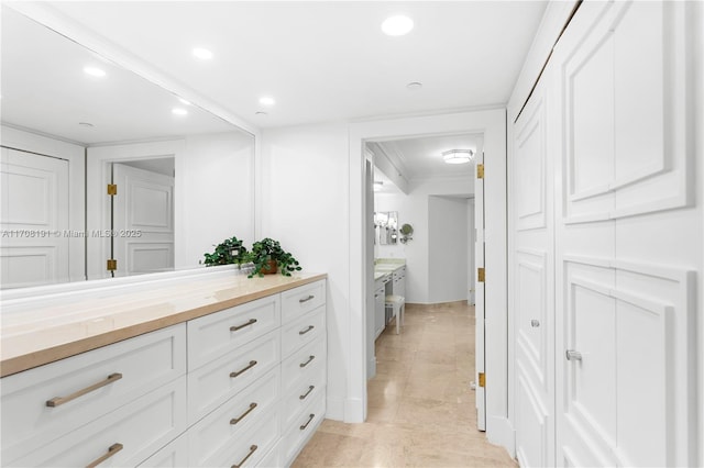 bathroom with vanity and recessed lighting