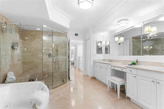 full bathroom featuring a whirlpool tub, a stall shower, and crown molding