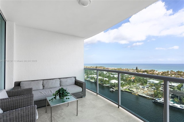 balcony featuring a water view and outdoor lounge area