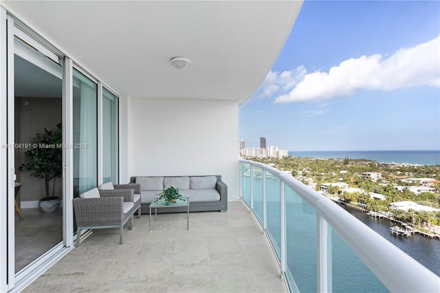 balcony featuring an outdoor hangout area and a water view