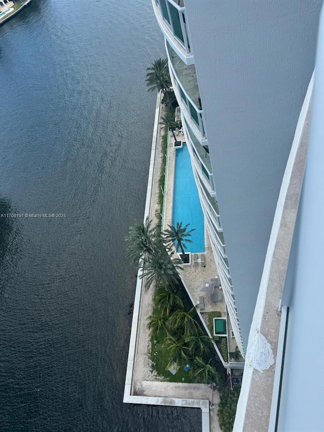 view of swimming pool with a water view