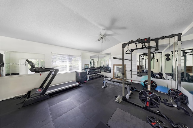 gym featuring ceiling fan, a textured ceiling, and vaulted ceiling