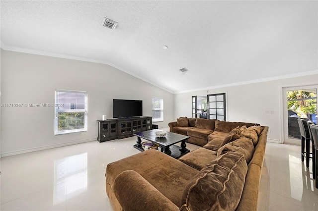 tiled living room featuring a textured ceiling, crown molding, and lofted ceiling