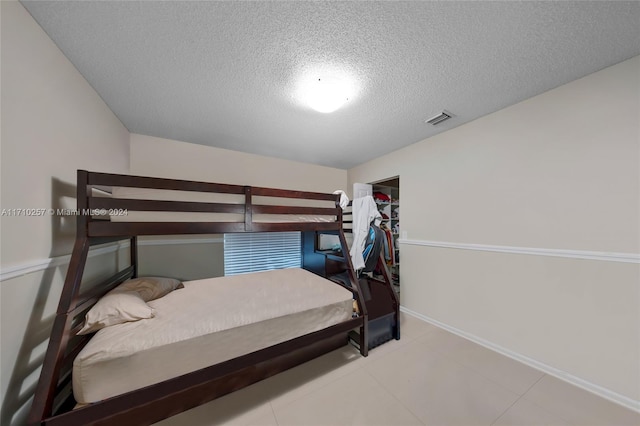 bedroom with a textured ceiling