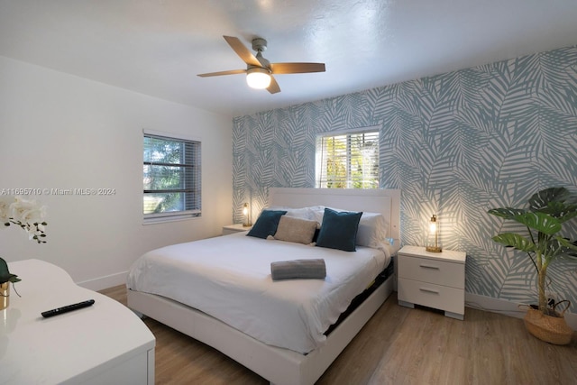 bedroom featuring light hardwood / wood-style flooring and ceiling fan