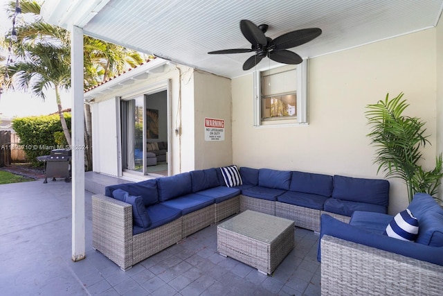 view of patio with an outdoor living space and ceiling fan