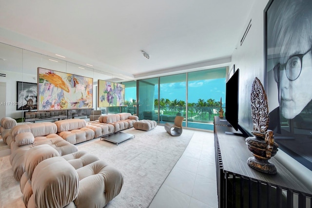 living room featuring floor to ceiling windows