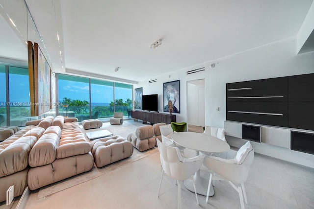 living room featuring a wall of windows