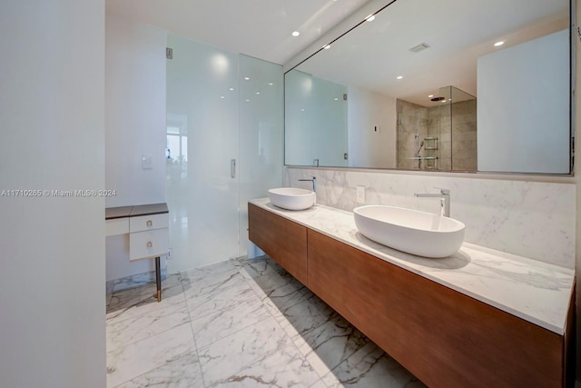 bathroom featuring vanity and an enclosed shower