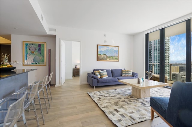 living room with light hardwood / wood-style flooring